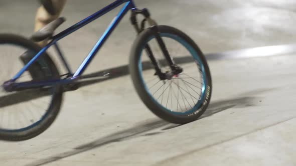 MTB Bicycle Rider Does Various Tricks While Riding in Skatepark 