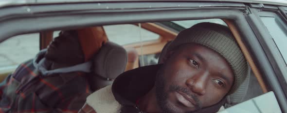 Pensive African American Man Sitting in Car