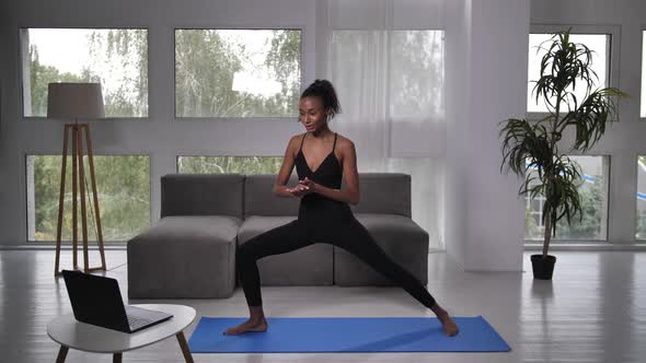 Slim Female Online Yoga Instructor During Practice