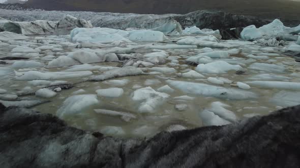 Flying Over Icebergs Towards Glacier Tongue End