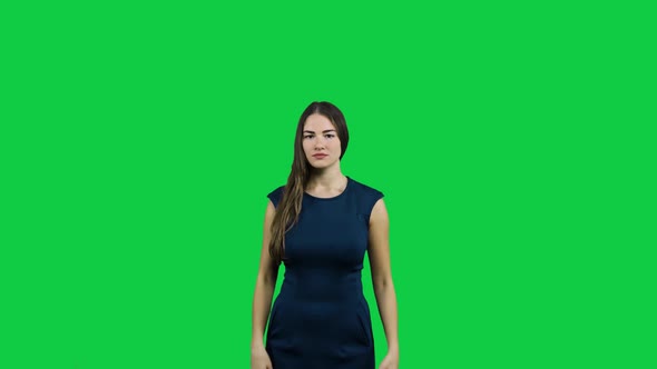 Frustrated annoyed girl in front of a green screen