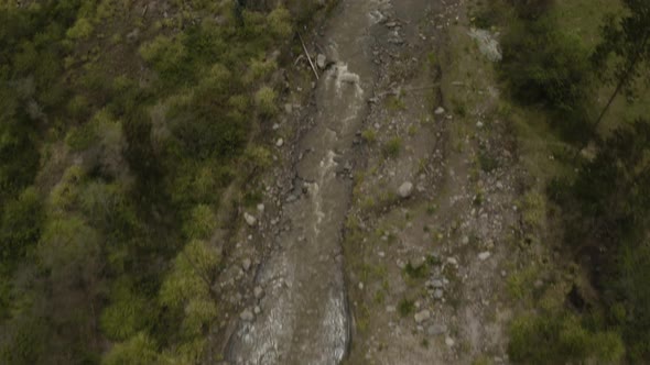 Aerial tilts up on a beautiful track to Quilotoa, Ecuador.