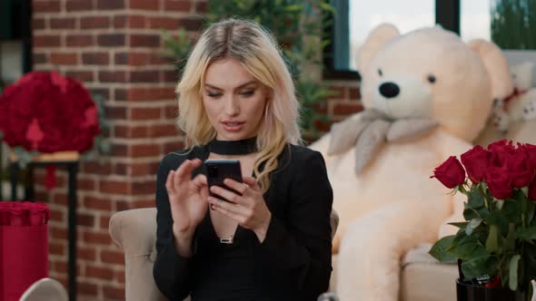 Attractive Girlfriend Holding Smartphone Talking with Remote Boyfriend