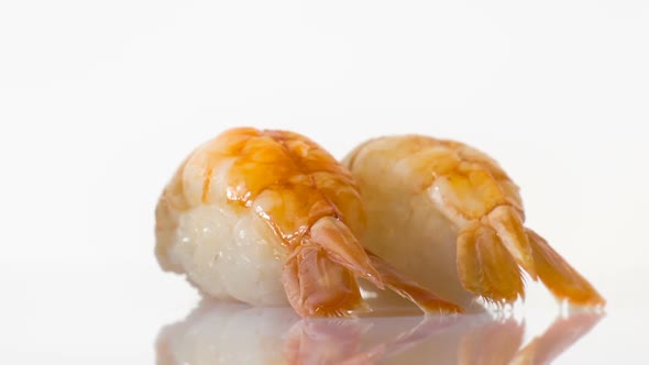 Two Spinning Shrimp Sushi Isolated on the White Background.