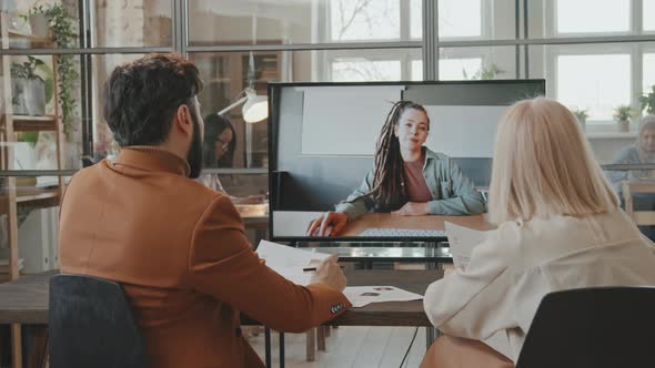 HR Conducting Online Job Interview with Woman