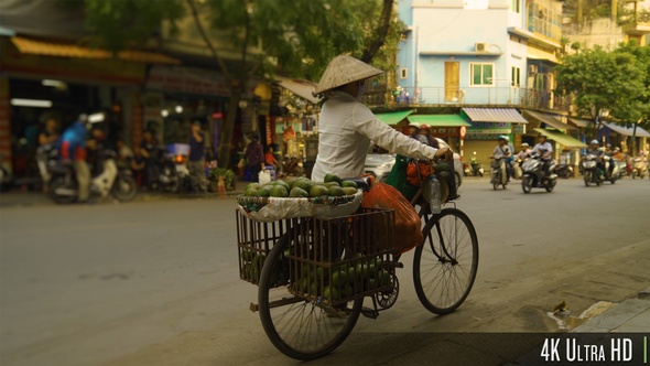 4K Vietnamese Woman Selling Fruit on a Bike in the Streets of Hanoi, Vietnam