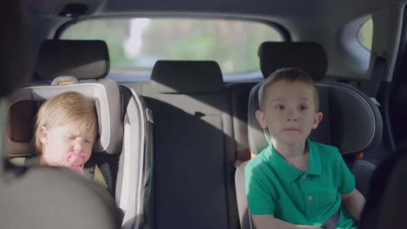 Children are Traveling in the Car in Their Child Car Seats