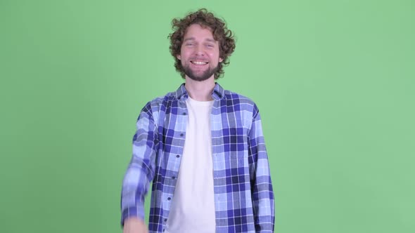 Happy Young Bearded Hipster Man Showing Ok Sign