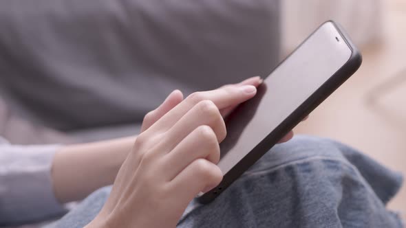 close up hand.In the morning, an Asian designer works on a tablet with a stylus, sketching and writi