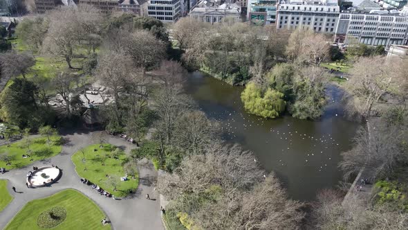 Drone shot of a city park in Dublin on a sunny day in Spring.