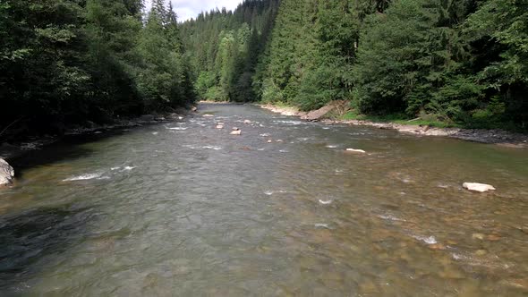 View of Ukrainian Mountain River at Summer Sunny Day