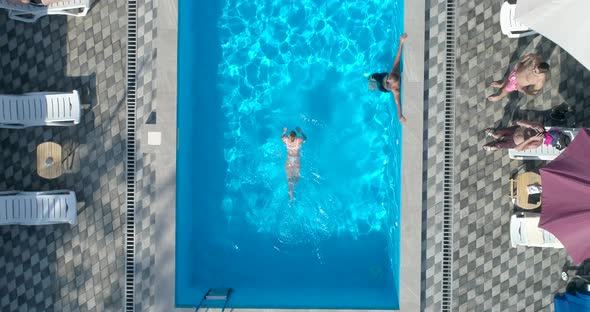 Girl swim in the swimming pool