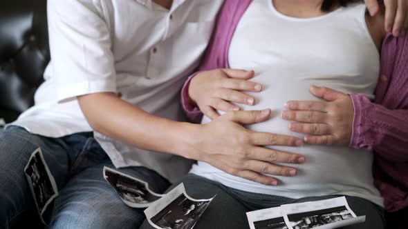 Pregnant Couple Feels Love and Relax at Home