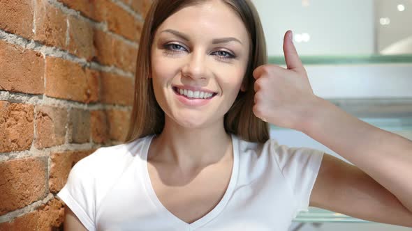 Thumbs Up by Young Woman, Positive gesture at Home