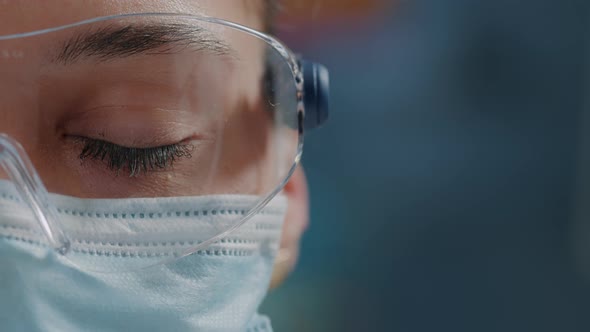 Scientist Showing One Eye on Camera in Laboratory