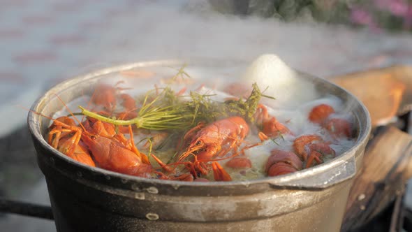 Crayfish Cook in Water with Spices and Herbs. Hot Boiled Crawfish. Lobster Closeup.
