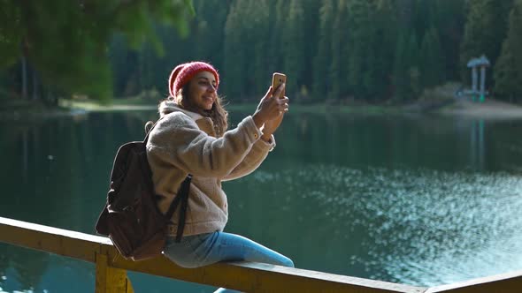 20s Hiker Photographer Hipster Woman in Woods Shooting Selfie Lake View