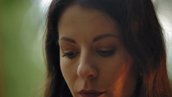 Extreme Close-up of a Girl's Artist's Eyes Painting Her Picture Outdoor.