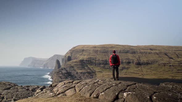 Man Standing Overlooking Sea