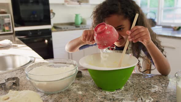 Young girl making Christmas cookies at home