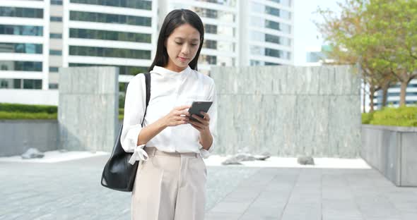 Young Woman use of smart phone in city