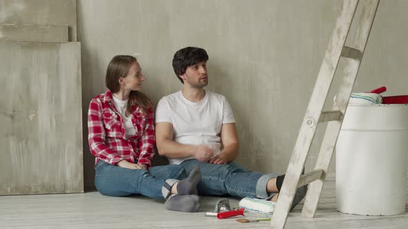 Happy Family Couple Relaxing After Painting