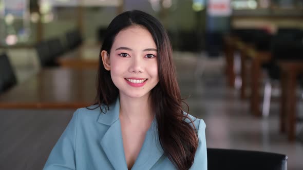 The eyes of an Asian woman smiling happily.