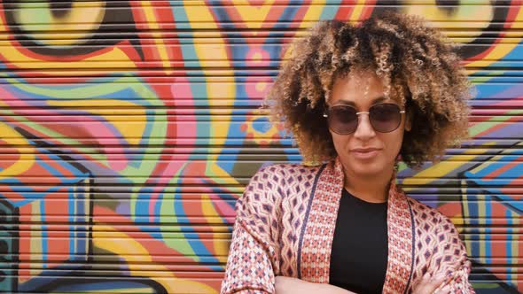 Young Stylish Ethnic Woman Against Graffiti 