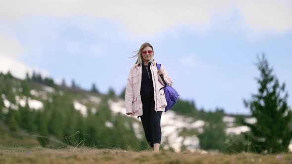 Young Traveller Woman Walking Alone on Valley of High Mountain