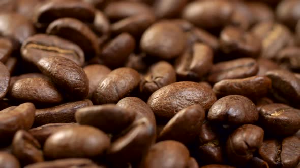 Brown Appetizing Roasted Coffee Beans on a Rotating Panel. Close-up Shot