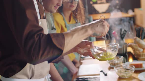 Chef Mixing Ingredients during Culinary Class