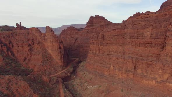 Aerial view flying over Onion Creek Narrows viewing the road winding through