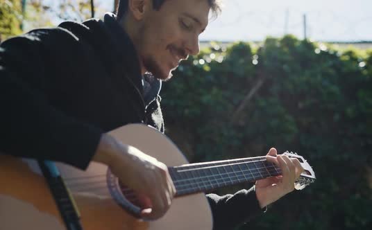 Young Man Playing Guitar