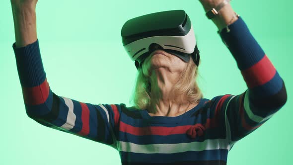 Old Woman Pensioner Experiencing Virtual Reality