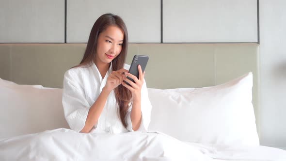 Young asian woman use smart phone