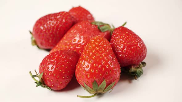 Fresh Strawberries Rotating Slowly White Background