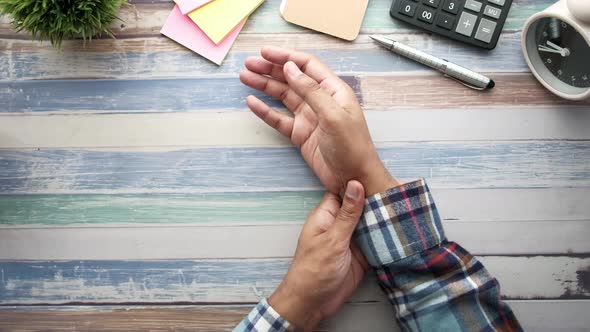 Man Suffering Pain in Hand Close Up