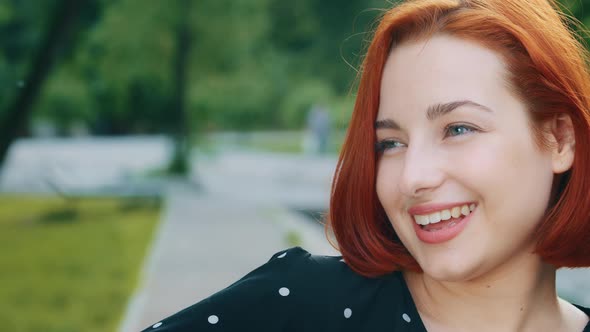 Close Up Pretty Female Face with Natural Makeup Seductive Attractive Caucasian Redhead Woman Smiling