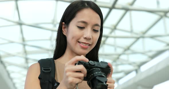 Woman travel in Hong Kong and taking photo with digital camera 