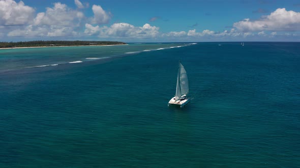 Catamaran in Turquoise Water Against the Background of the Paradise Island Mauritius