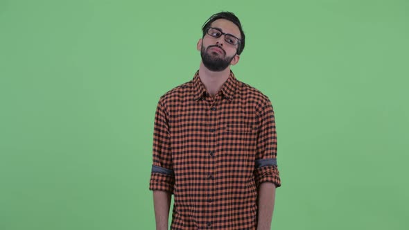 Stressed Young Bearded Persian Hipster Man Looking Bored and Tired