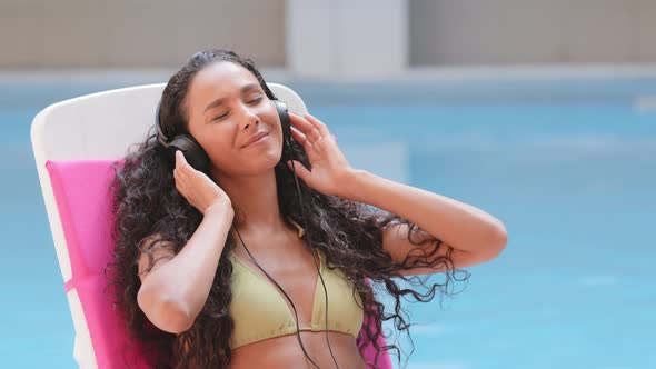 Happy Latina Girl Wearing Headphones Listening Favorite Modern Music Enjoying Summer Vacation