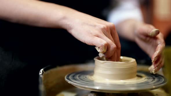 Closeup of Hands Potter Wheel Pot Pottery