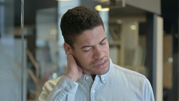 Tired Young African Man Having Neck Pain