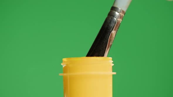 Yellow Paint Isolated on Green Background