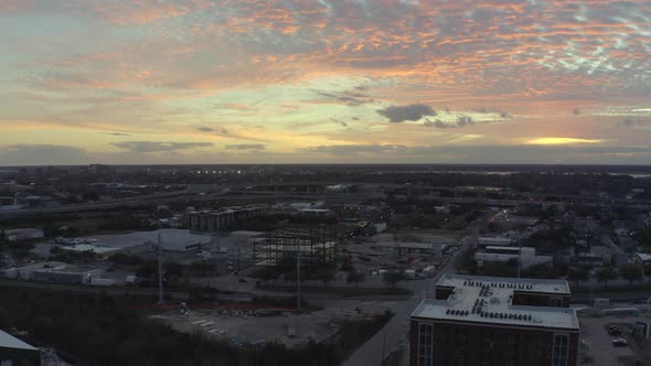 Flying over commercial area of Charleston at sunset