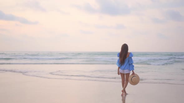 Asian woman enjoy around beautiful beach sea ocean