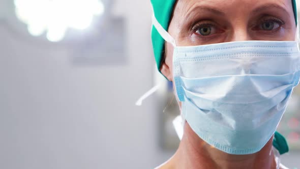 Female nurse in surgical mask at operation theater