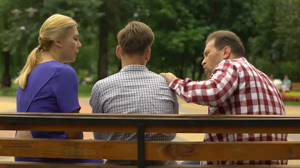 Male Teen Arguing With Parents on Bench and Walking Away, Adolescence Problems