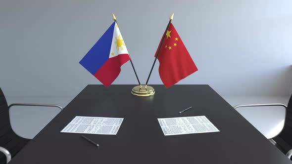 Flags of the Philippines and China and Papers
